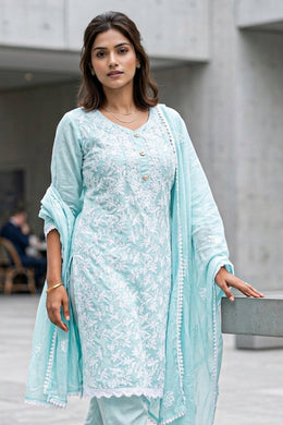 Woman wearing a light blue chikankari embroidered viscose Silk coord set outfit with a matching dupatta in an outdoor setting -  10076188