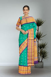 Gadwal Kuttu Weave Handloom Silk Saree in Jade Green with Royal Violet Peacock Border 10062952