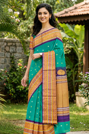 Teal Green Gadwal Kuttu Handloom Silk Saree With Violet Peacock Border 10077201