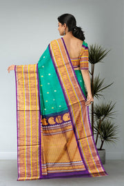 Gadwal Kuttu Weave Handloom Silk Saree in Jade Green with Royal Violet Peacock Border 10062952