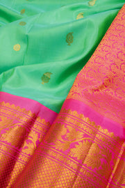 Teal Green Gadwal Kuttu Handloom Silk Saree With Pink Zari Border 10077202