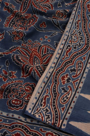 Graphite Blue Ajrakh Printed Mulmul Cotton Saree With Floral Motifs and Paisley Border 10076521