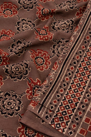 Cocoa Powder Brown Ajrakh Printed Mulmul Cotton Saree With Floral Motifs And Geometric Border 10076531