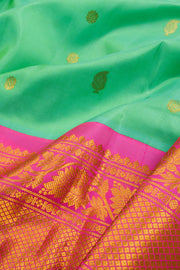 Gadwal Kuttu Weave Handloom Silk Saree in Pale Teal Green with Lotus Pink Zari Border and Pallu 10062955