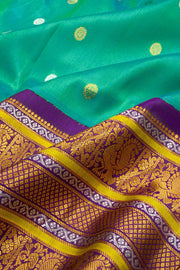 Teal Green Gadwal Kuttu Handloom Silk Saree With Violet Peacock Border 10077201