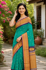 Teal Green Gadwal Kuttu Handloom Silk Saree With Violet Peacock Border 10077201