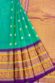 Teal Green Gadwal Kuttu Handloom Silk Saree With Violet Peacock Border 10077201