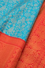 Ananda Blue Korvai Kanjivaram Pure Zari Handloom Silk Saree with Kodi Paravai Pattern and Contrast Chilli Red Border 10058738